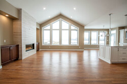 Cathedral ceilings add to the open concept of this bright and stylish living room.